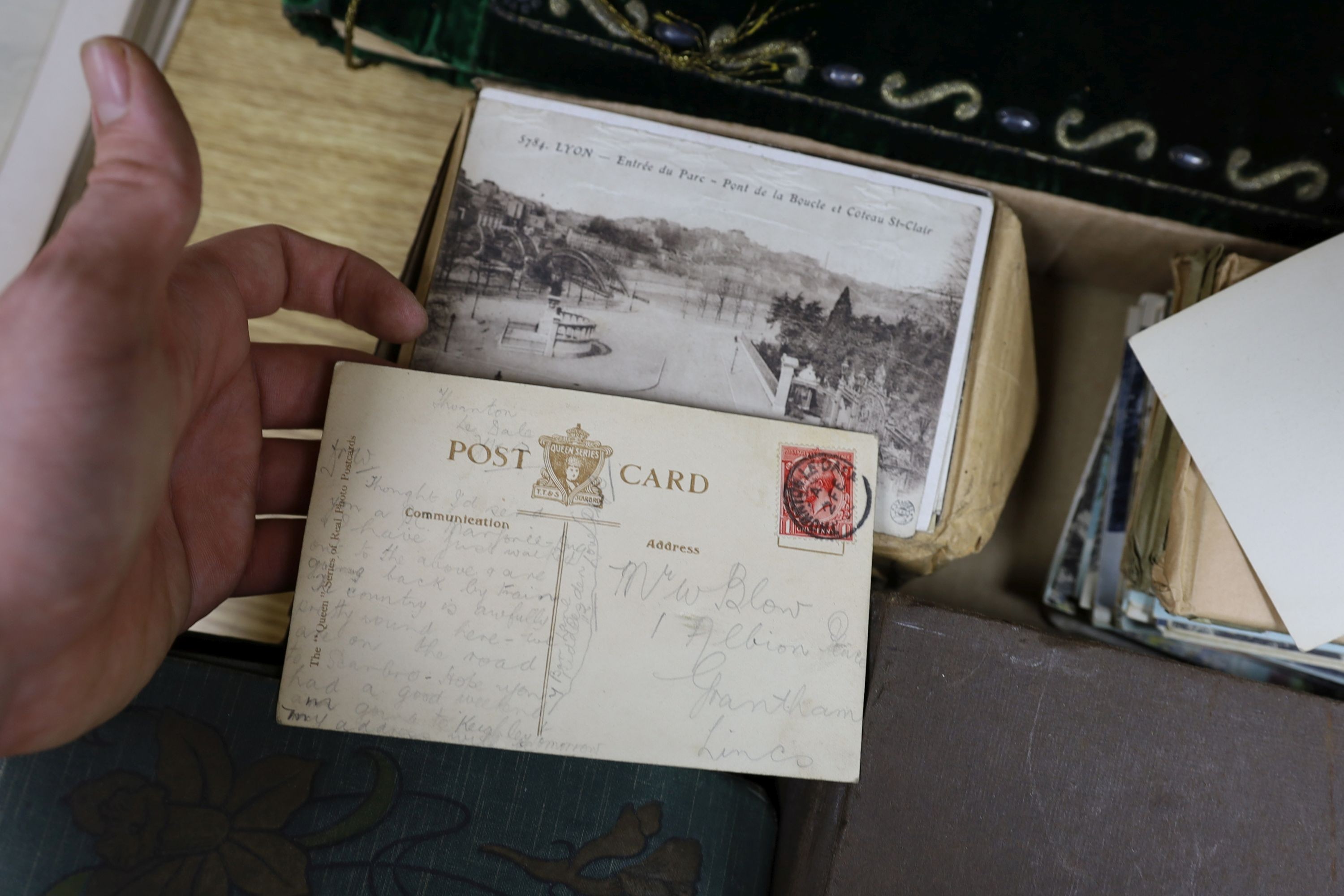 An album of late 19th / early 20th Century postcards and a quantity of loose cards